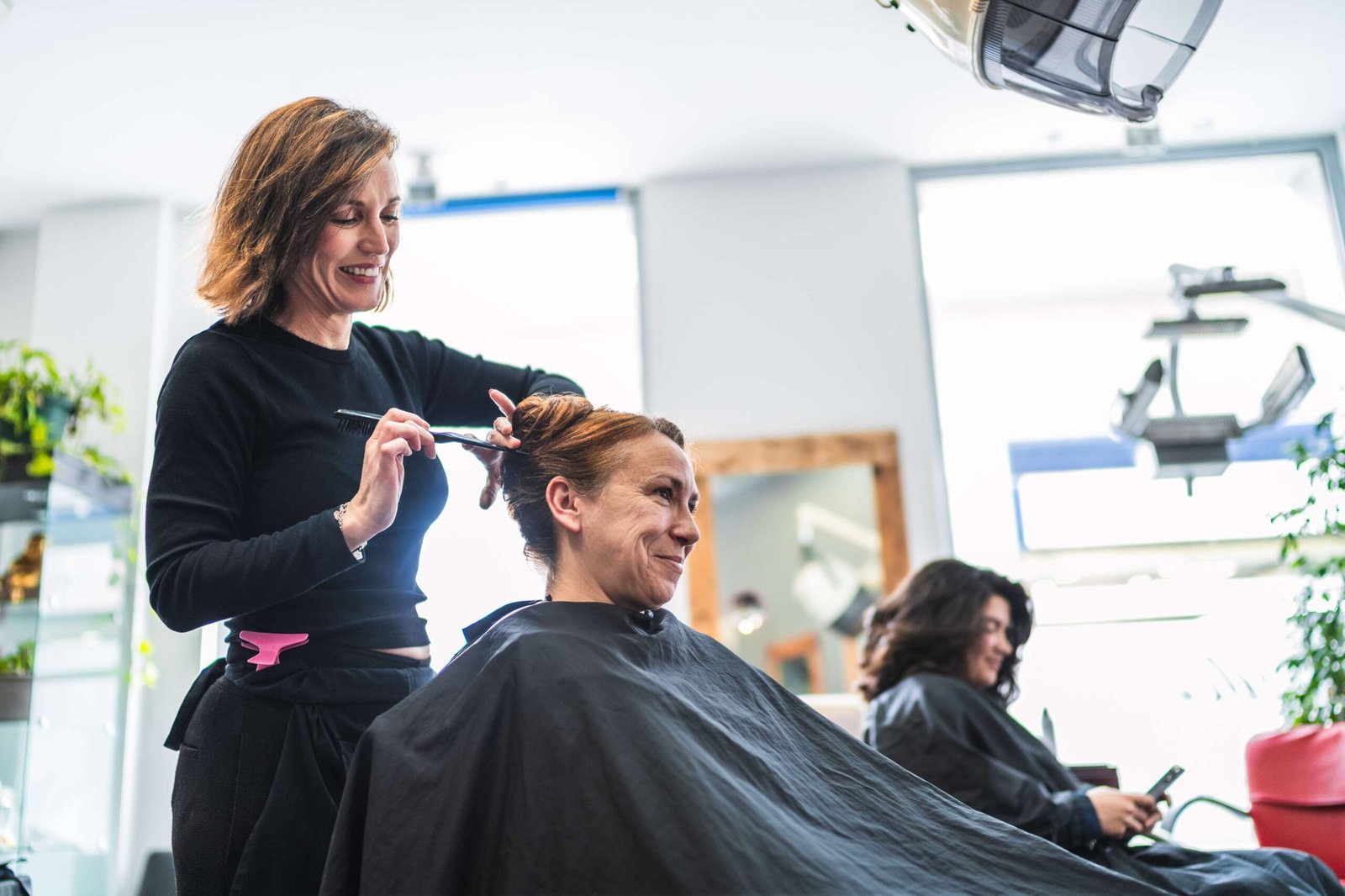 hairdresser-styling-client-s-hair-in-modern-salon-2026-01-08-08-23-08-utc (1)